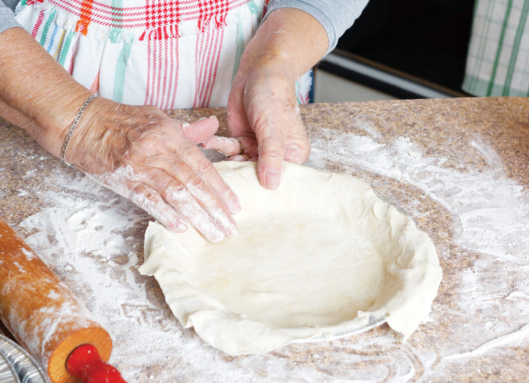 woman making a pie in the kitchen